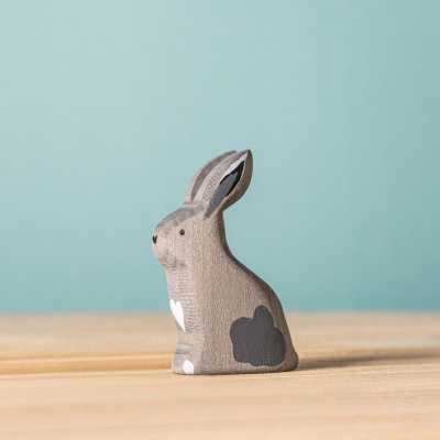 The hand-painted Grey Sitting Rabbit by BumbuToys, a sweet addition to any wooden animal collection.