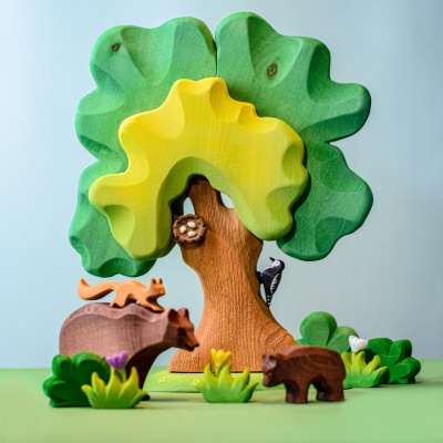 The vibrant Large Green Oak, crafted by BumbuToys, beckons imaginative play under its leafy boughs.