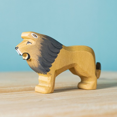 The King of the Jungle by BumbuToys, a wooden figure showcasing the lion's noble mane and stature.
