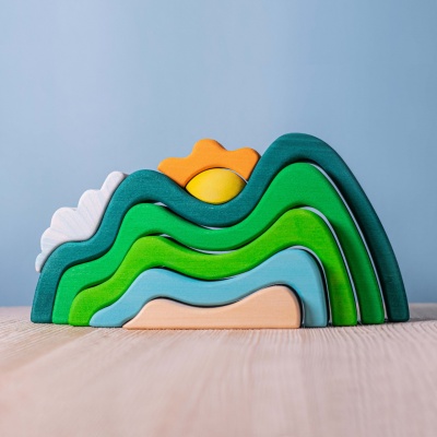 BumbuToys' serene Mountains, Cloud, and Sun wooden puzzle, inviting peaceful play.