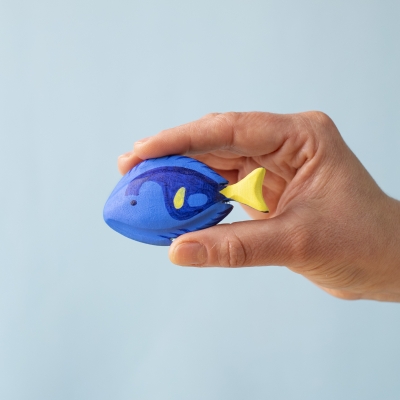 Royal Blue Fish held between fingers, showing size and painted detail