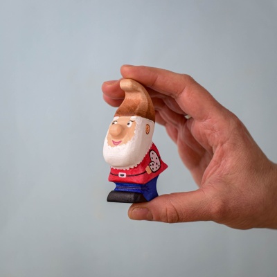 Whittle Dwarf held in hand, showcasing its compact size and fine details.