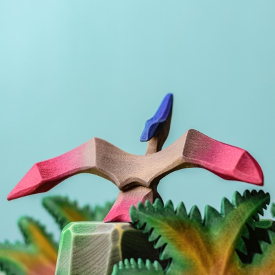 Pteranodon toy in a natural setting, ideal for imaginative prehistoric play