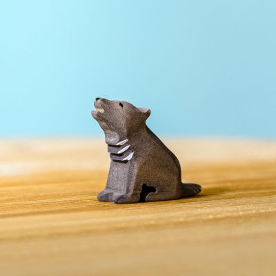 Handcrafted Wolf Cub Sitting wooden toy by Bumbu Toys, perfect for storytelling