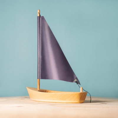 Artisan sailing boat in anthracite, a BumbuToys creation for imaginative seas.
