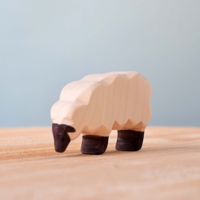 Close-up of the sheep figurine, highlighting its detailed features and gentle expression.