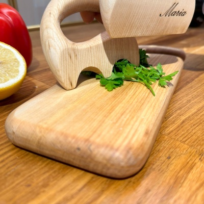 Close-up of using the wooden salad spatula to chop parsley