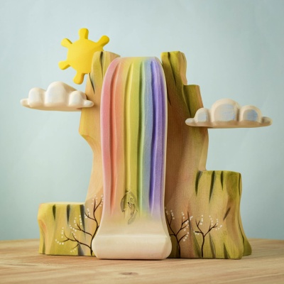 Handcrafted Rainbow Cliff playset with a cascading rainbow waterfall and sun.