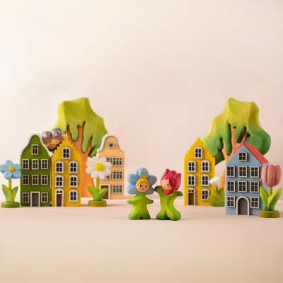 Hand-painted purple crocus wooden toy held upright by a small green wooden flower stand