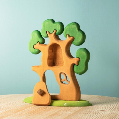 Close-up image of the open treehouse door, revealing the cozy interior with space for small animal toys.