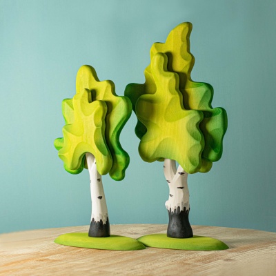 A duo of wooden Green Birch Trees by BumbuToys, perfect for creating a miniature springtime forest scene.