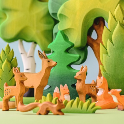 The wooden tree displayed on a Montessori shelf, inviting open-ended exploration and creativity during winter.