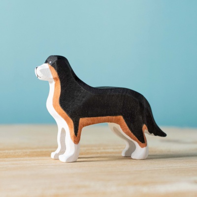 Close-up of the Berna Sheepdog's face, showcasing its hand-painted details and alert expression.