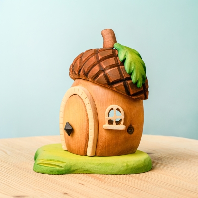Wooden acorn house toy disassembled into roof walls door and base