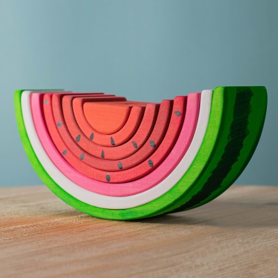 Wooden watermelon puzzle pieces from BumbuToys, capturing the essence of summer fruit.
