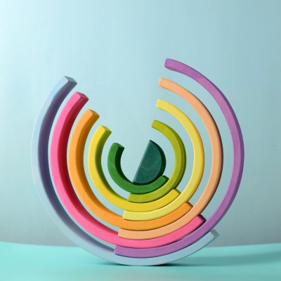 Colorful arches of the Large Rainbow toy arranged in a unique pattern.