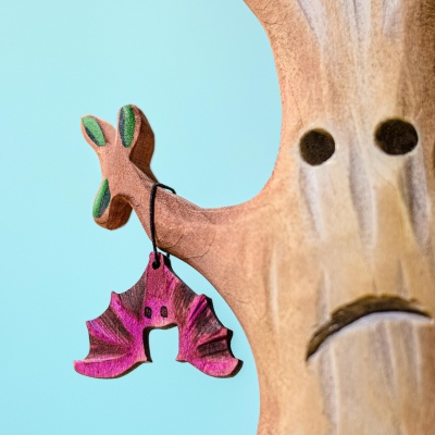 Child engaging in imaginative play with the eco-friendly Bat toy