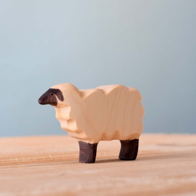 Eco-friendly artisanal wooden sheep figure.
