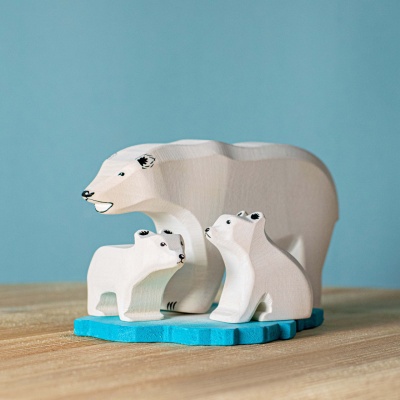 A family of wooden polar bears on an ice floe by BumbuToys, perfect for Arctic storytelling.