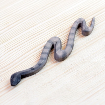 BumbuToys' handcrafted Snake toy, a smooth and tactile addition to any educational playset