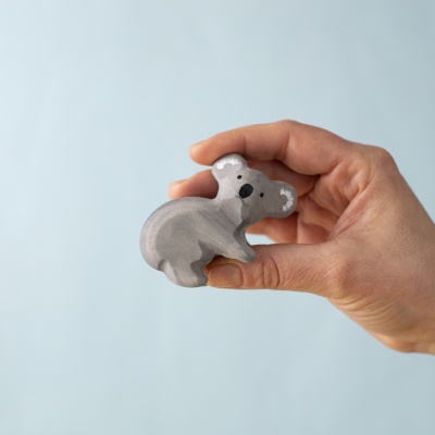 Adult koala held in hand, showing soft curves and craftsmanship.