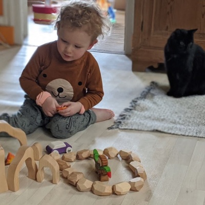 A child using the treehouse in pretend play, imagining it as a home for woodland animals or fairies.