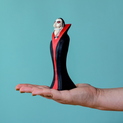 Child playing with the Dracula The Vampire figurine, sparking imagination