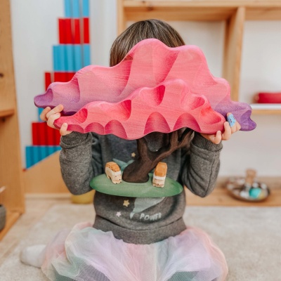 The hedgehog being used in a counting or sorting activity with other small woodland animal toys.