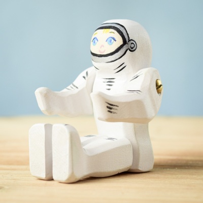 Astronaut toy sitting, ready for imaginative play.