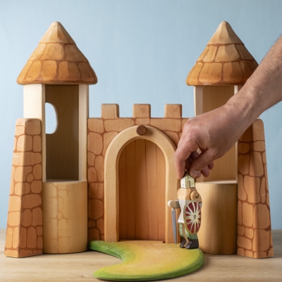 Castle setup with path and toy knight figure approaching the entrance.