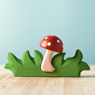 Close-up shot of the red mushroom, highlighting its hand-painted details and realistic texture.