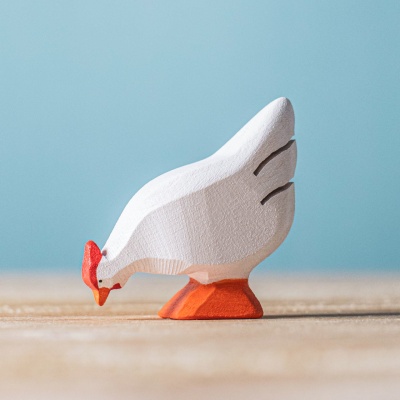 Close-up photo showcasing the smooth wood grain and details of the BumbuToys White Hen.