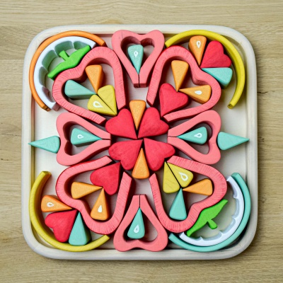 A set of wooden fruits by BumbuToys encouraging healthy eating through play.
