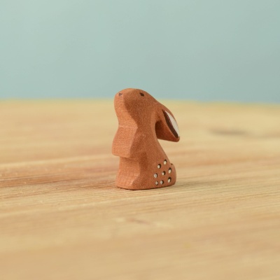 Small wooden Curious Baby Rabbit in an alert pose