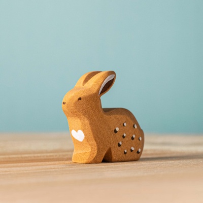 BumbuToys' Sitting Rabbit, a wooden figure showcasing the quiet poise of a rabbit in repose.