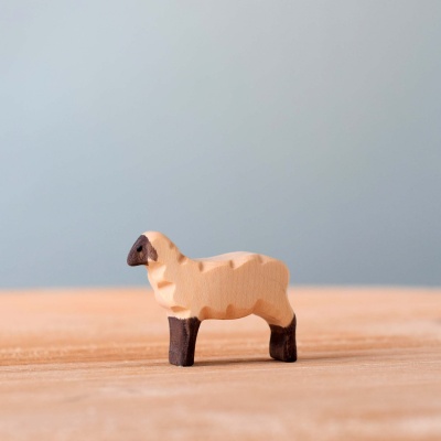 Close-up of the lamb figurine, highlighting its detailed features and expressive face.