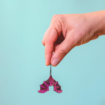 Close-up of the artisanal Bat figurine, highlighting its realistic design