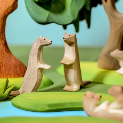 Detailed Wooden Otter Family in Playful Poses