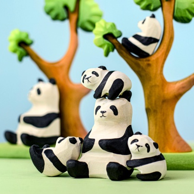 Wooden panda bear family with cubs playing