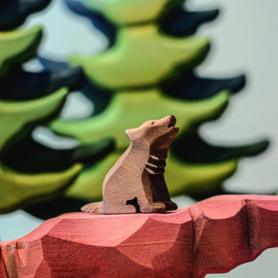 Sustainable, hand-painted Wolf Cub Sitting, safe and engaging for kids
