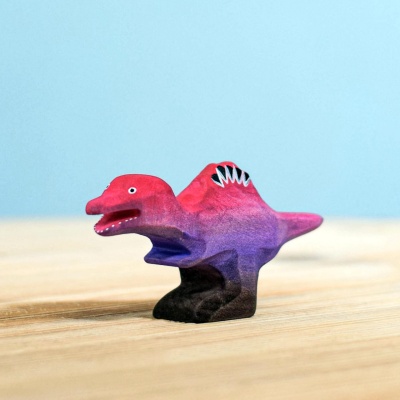 Handcrafted wooden baby Spinosaurus dinosaur figurine