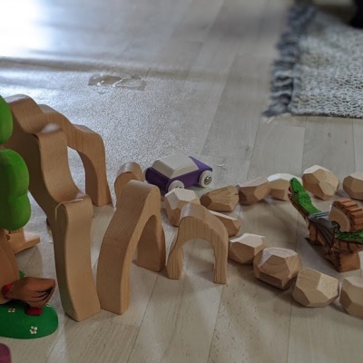 The treehouse featured in a pretend picnic scene set on its platform.