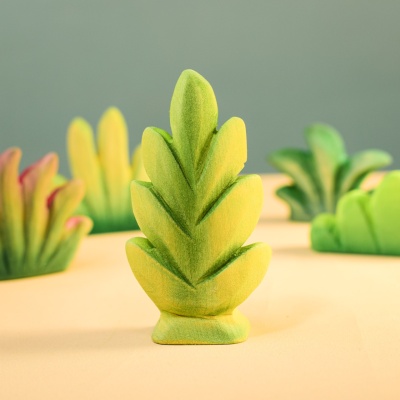 Thuja Shrub among other wooden toy plants.