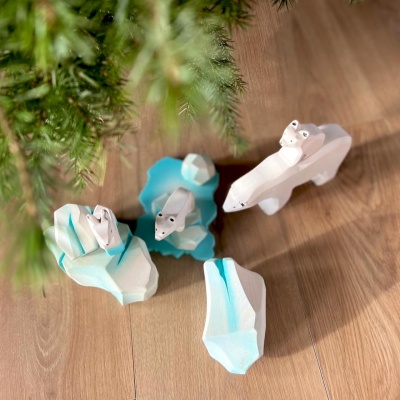 The Polar Bear as part of a winter-themed play scene, interacting with other plush animals or Arctic-themed toys.