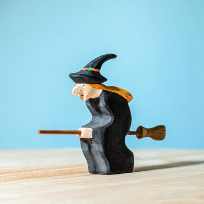 Handcrafted Witch figurine by BumbuToys with a broom and pointed hat.
