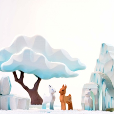 Sustainable wooden fawn from BumbuToys, colored in tranquil hues for creative play