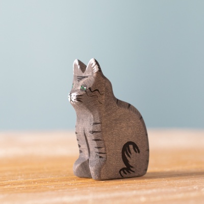 Close-up of the Cat's face, showcasing its hand-painted details and simple, friendly expression.