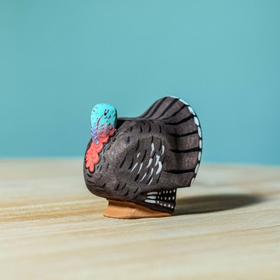 Intricately handcrafted turkey figurine by BumbuToys, showcasing artisanal details.