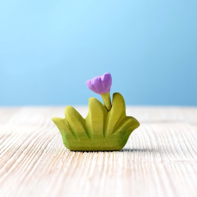 Sustainable small grass with purple flower play piece.