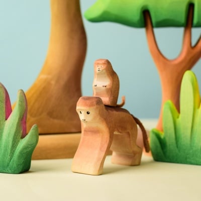 Monkey and Baby Monkey among other wooden toy plants and animals.